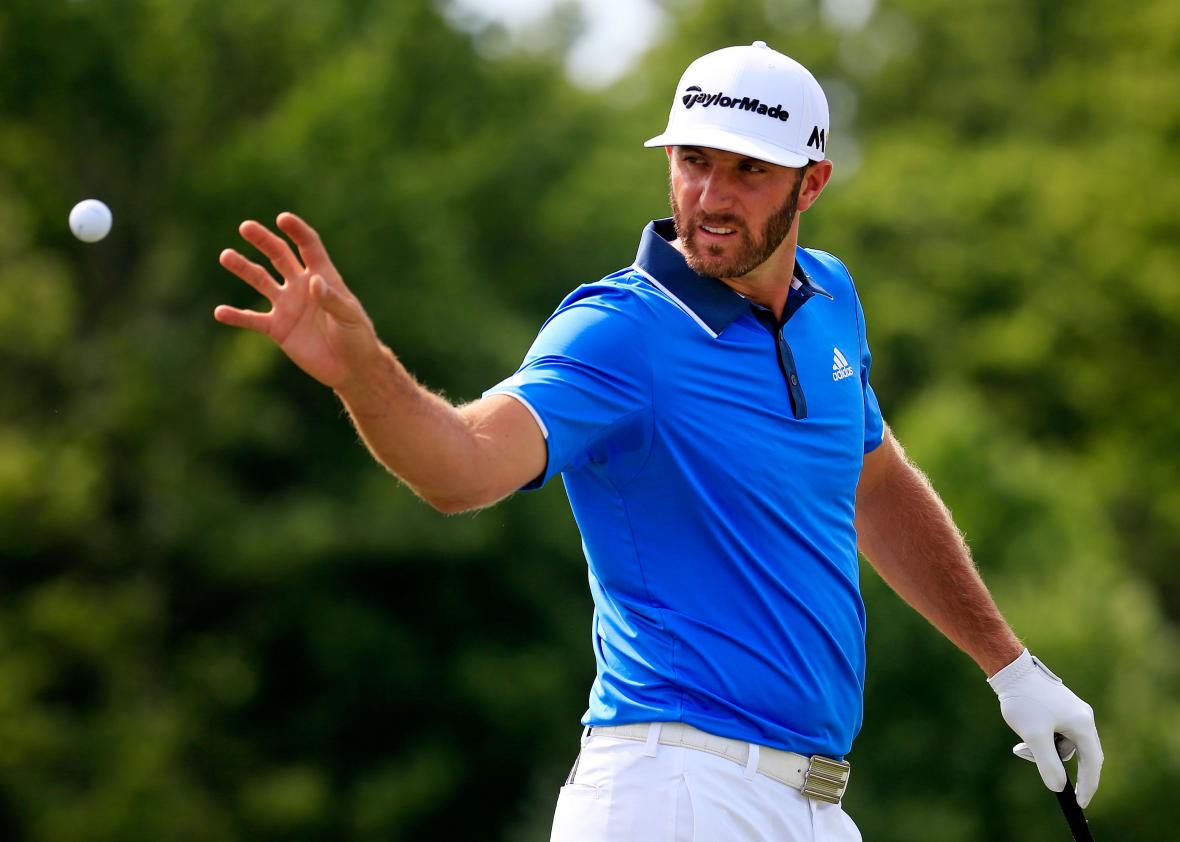 dustin-johnson-of-the-united-states-reaches-for-a-golf.jpg.CROP.promo-xlarge2